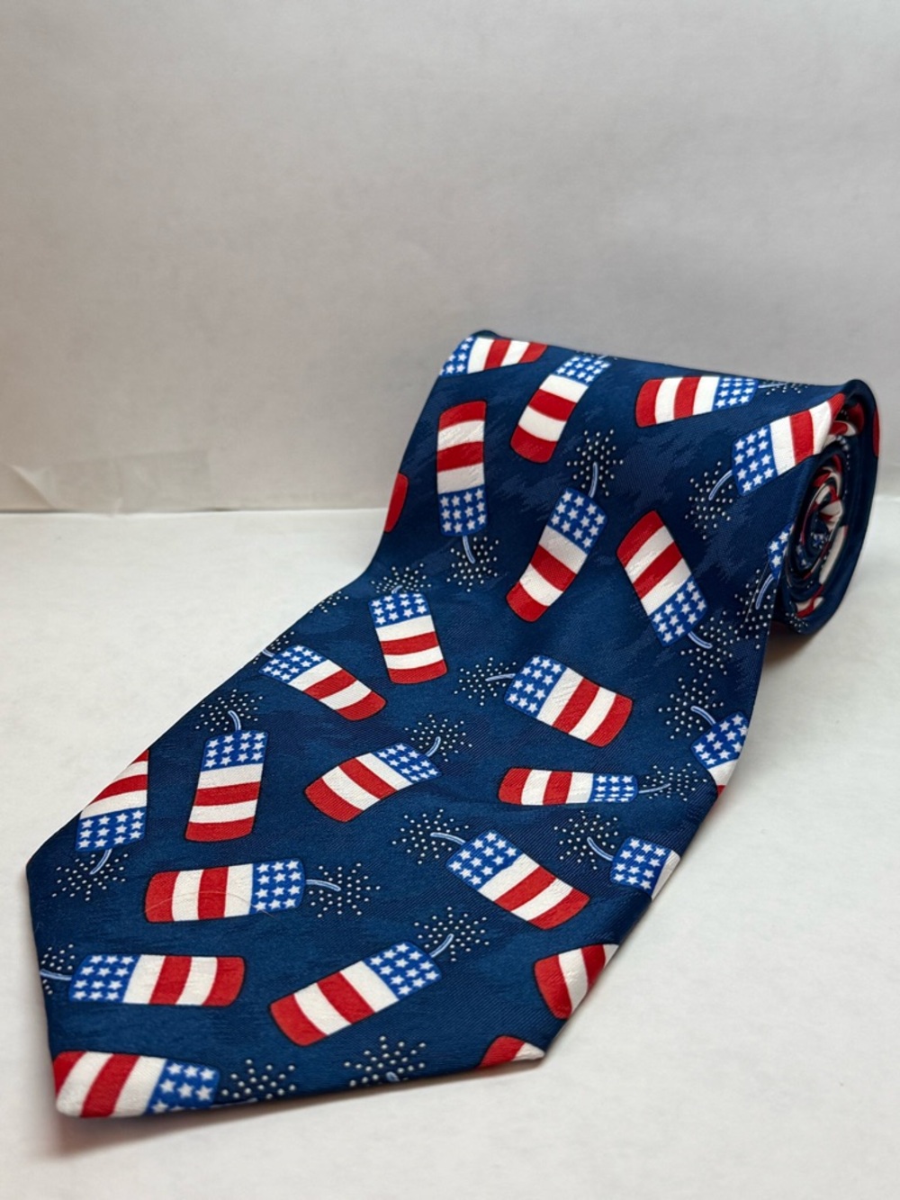 Men's Patriotic Blue Tie with Red & White Firecracker Pattern
